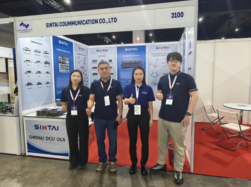 The Sintai team of four posing with thumbs-up at their exhibition booth, number 3100, during the Smart Nation Expo in Kuala Lumpur.